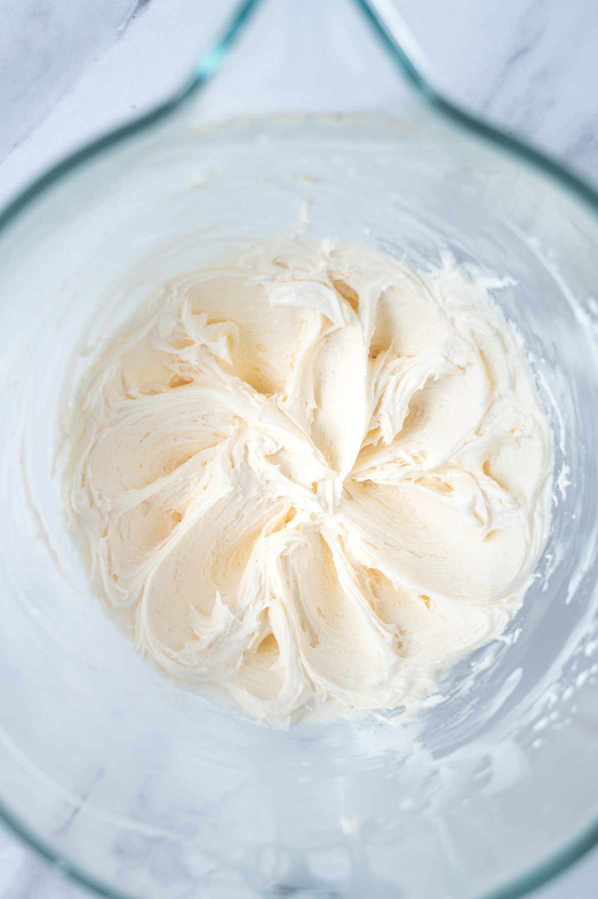 creamy vanilla cream frosting in a mixing bowl