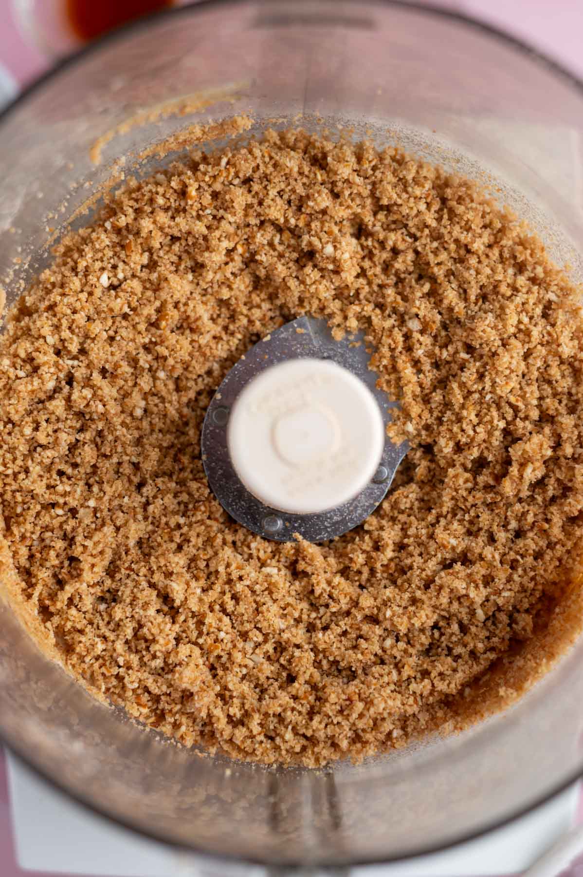 pretzel graham crust in the bowl of a food processor
