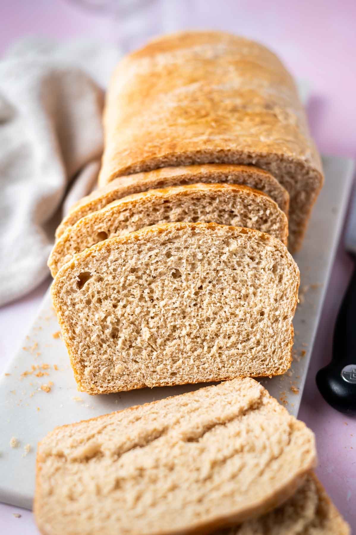 slices of bread on a cutting board with a napkin