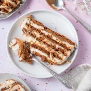 slice of biscoff icebox cake on a plate with a fork