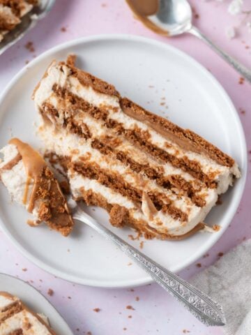 slice of biscoff icebox cake on a plate with a fork