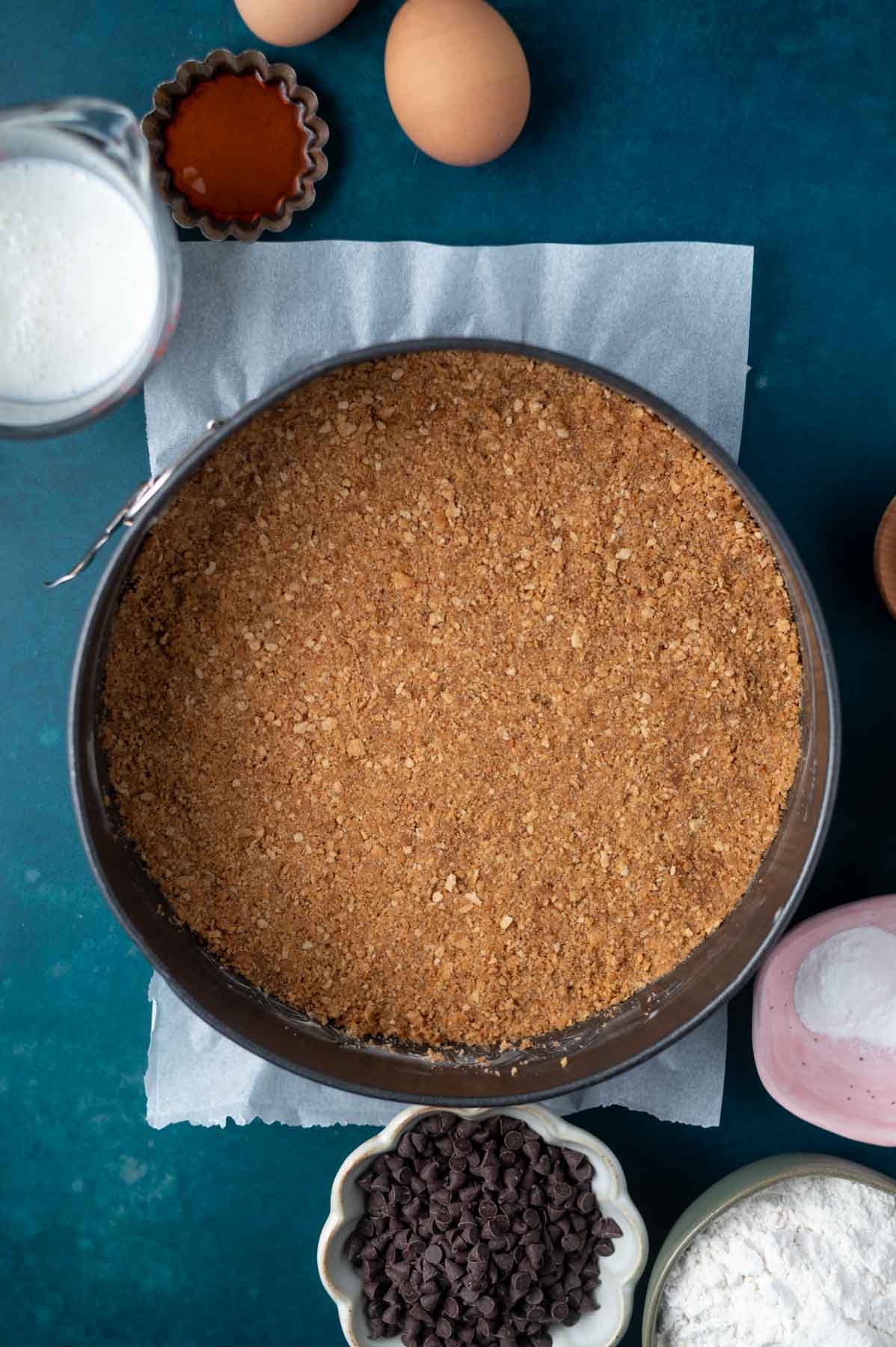 cannoli crust packed into the bottom of a springform pan