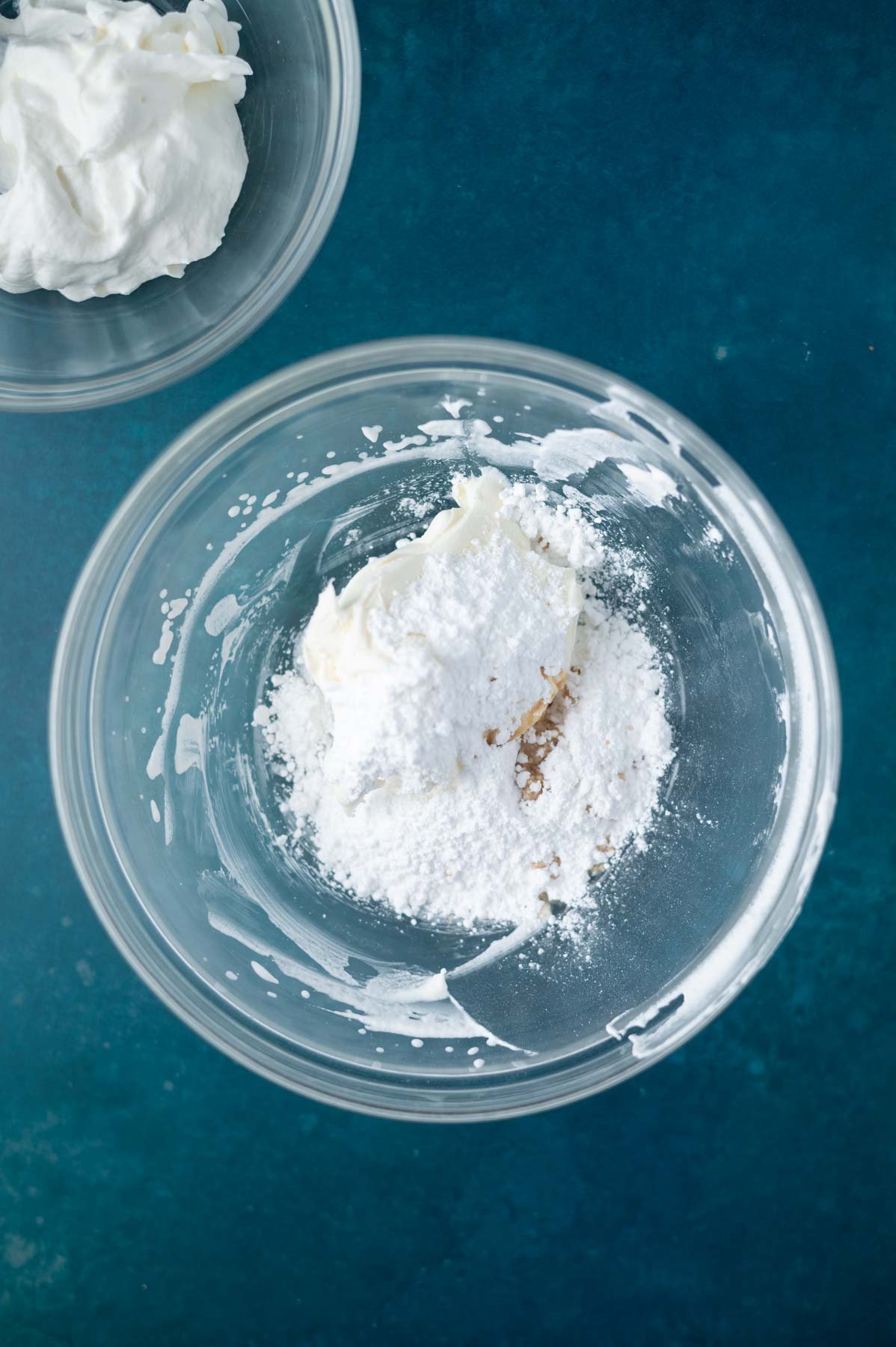 mascarpone, confectioners' sugar and vanilla in a glass mixing bowl
