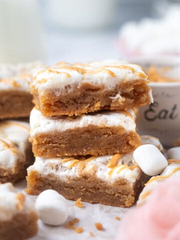 stack of fluffernutter bars on parchment paper with mini marshmallows
