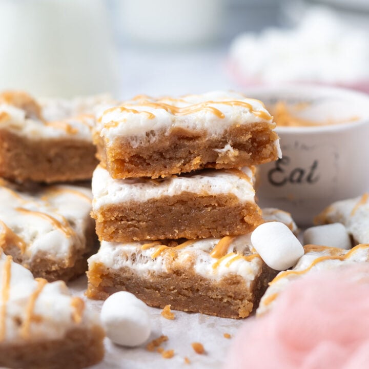 stack of fluffernutter bars on parchment paper with mini marshmallows