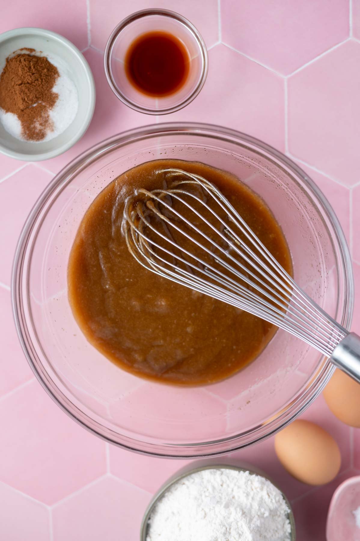 butter and sugars whisked together in a bowl