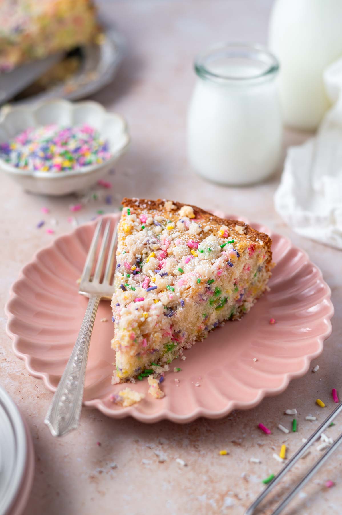 slice of cake on a plate with a fork