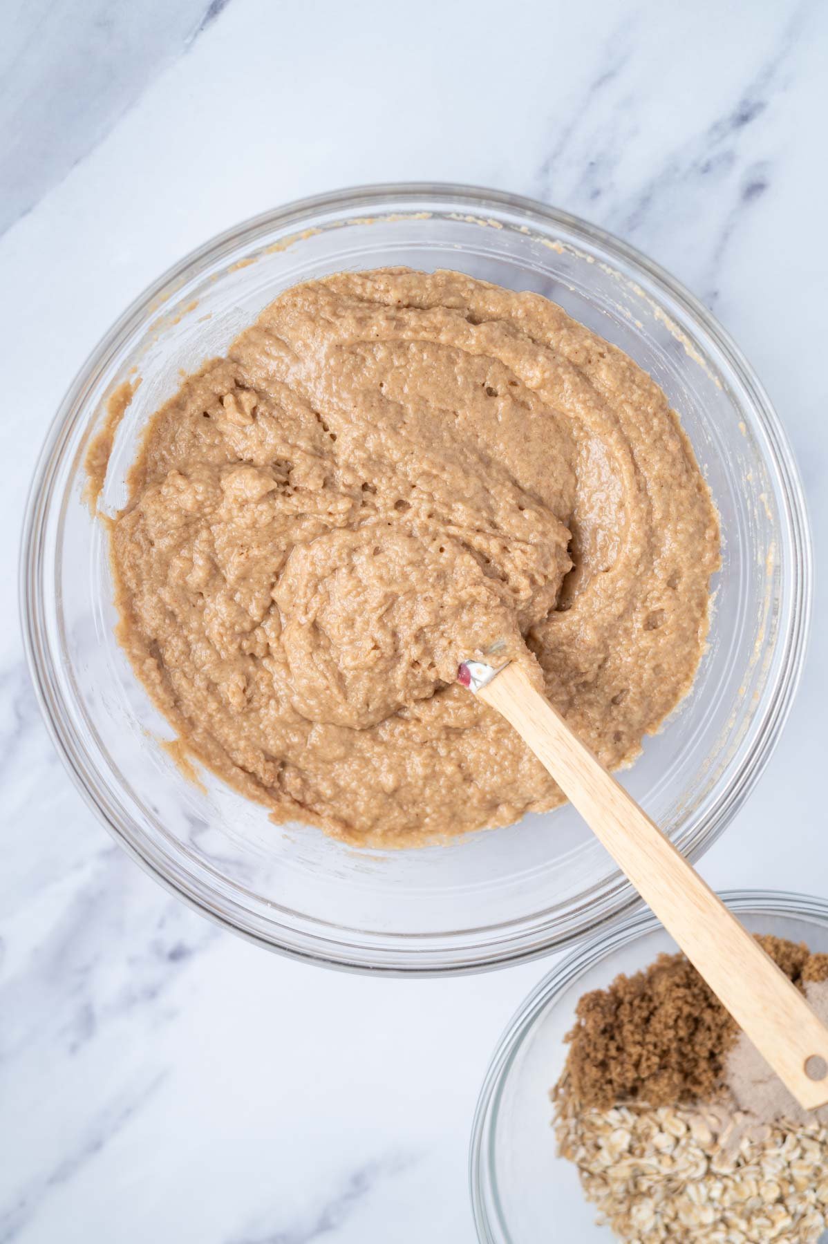 muffin batter mixed in a glass bowl