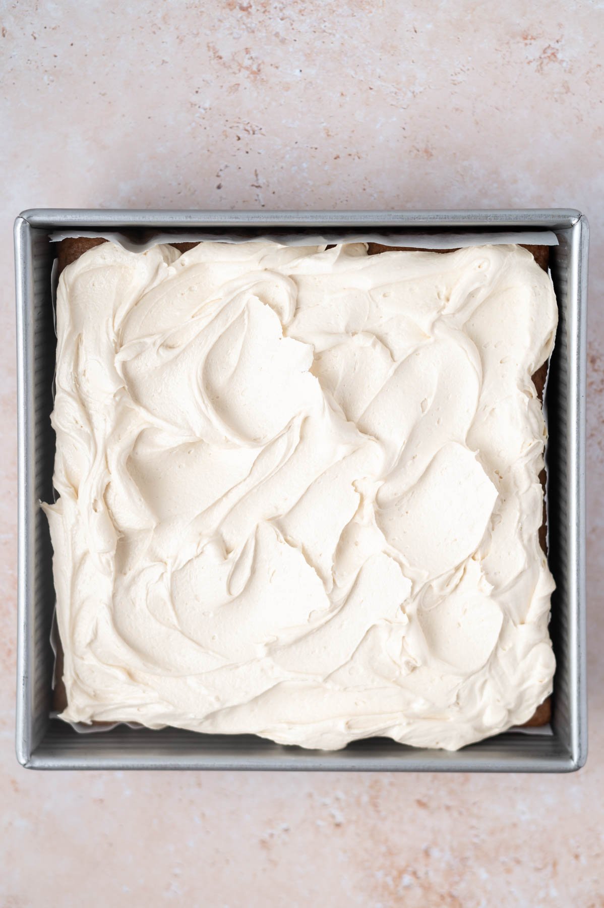 brown sugar frosting on cake in a baking tin