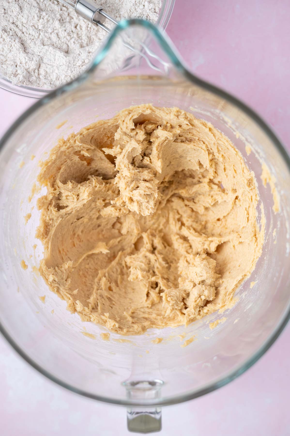 cookie dough in a mixing bowl after egg and vanilla have been added