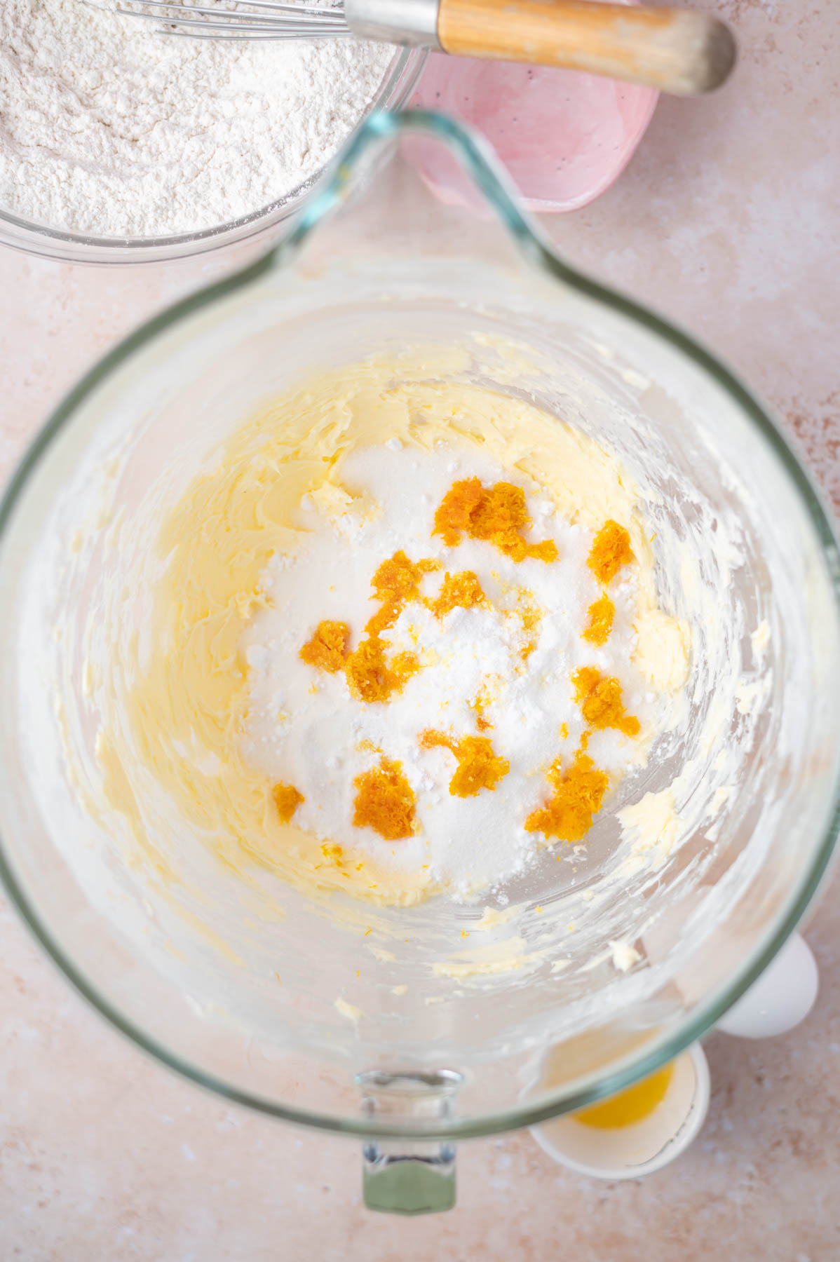 creamed butter, granulated and confectioners' sugar and orange zest in the bowl of a mixer