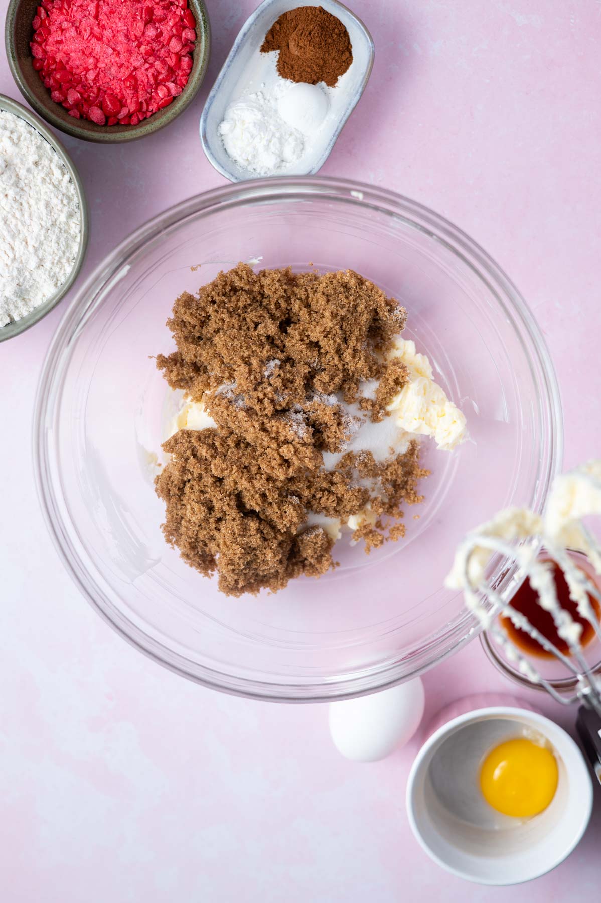 white and brown sugar added to butter in a mixing bowl