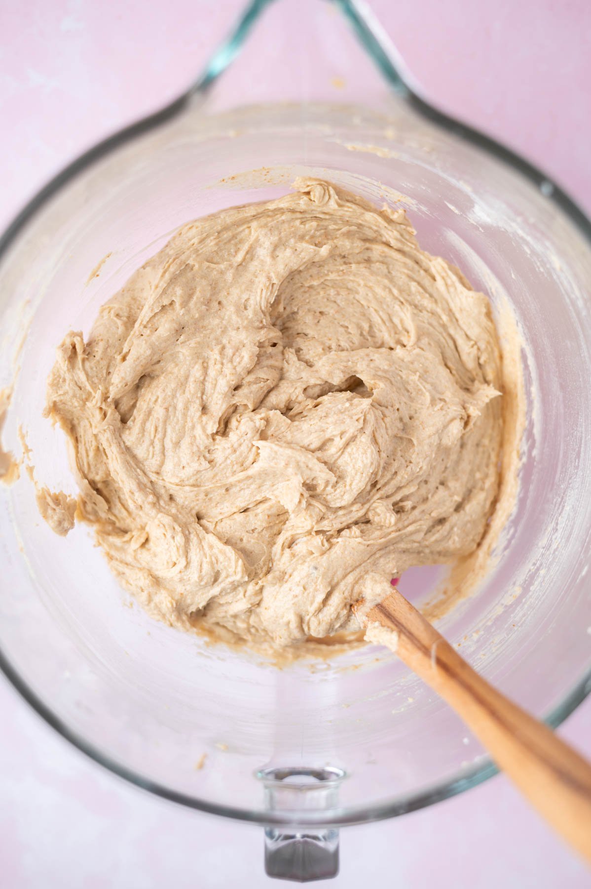 cake batter in a mixing bowl with a spatula