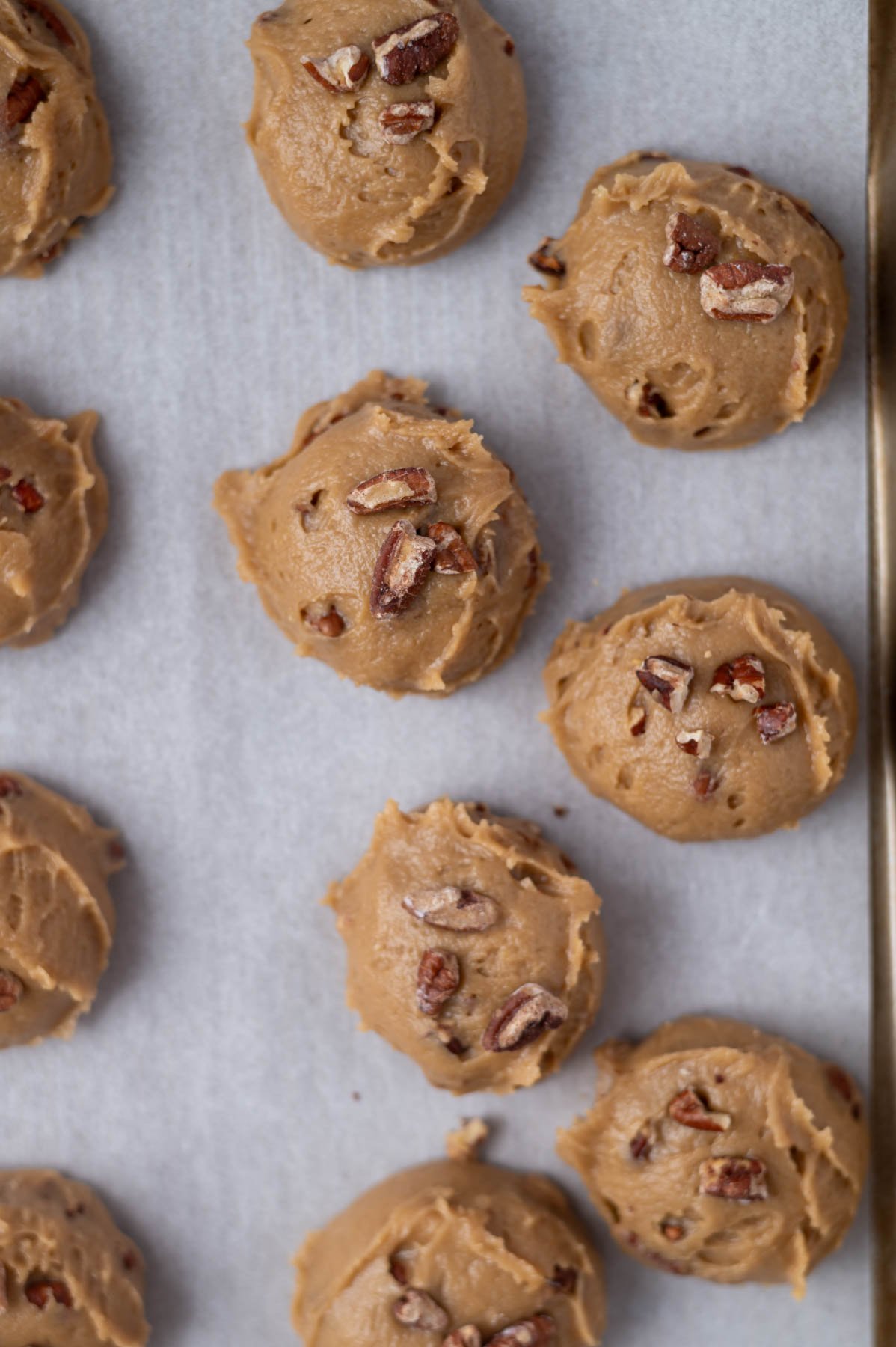 cookie dough on a parchment lined baking sheet