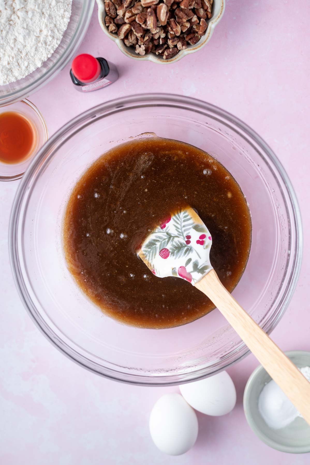 butter, sugar and maple syrup mixed together in a glass bowl