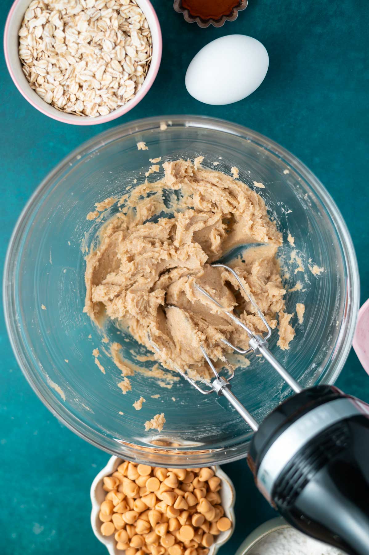 butter and sugars beaten together in a bowl with a handmixer