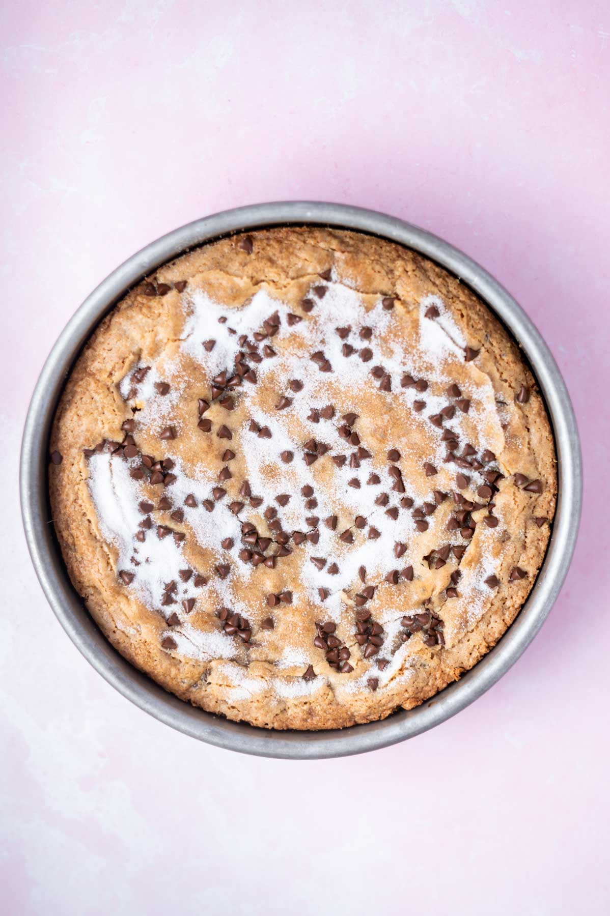 baked chocolate chip cake in a round pan