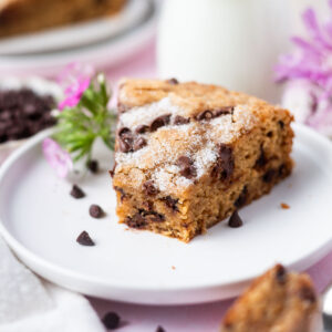 slice of chocolate chip snack cake on a plate with pink flowers