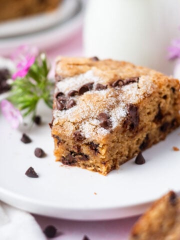 slice of chocolate chip snack cake on a plate with pink flowers