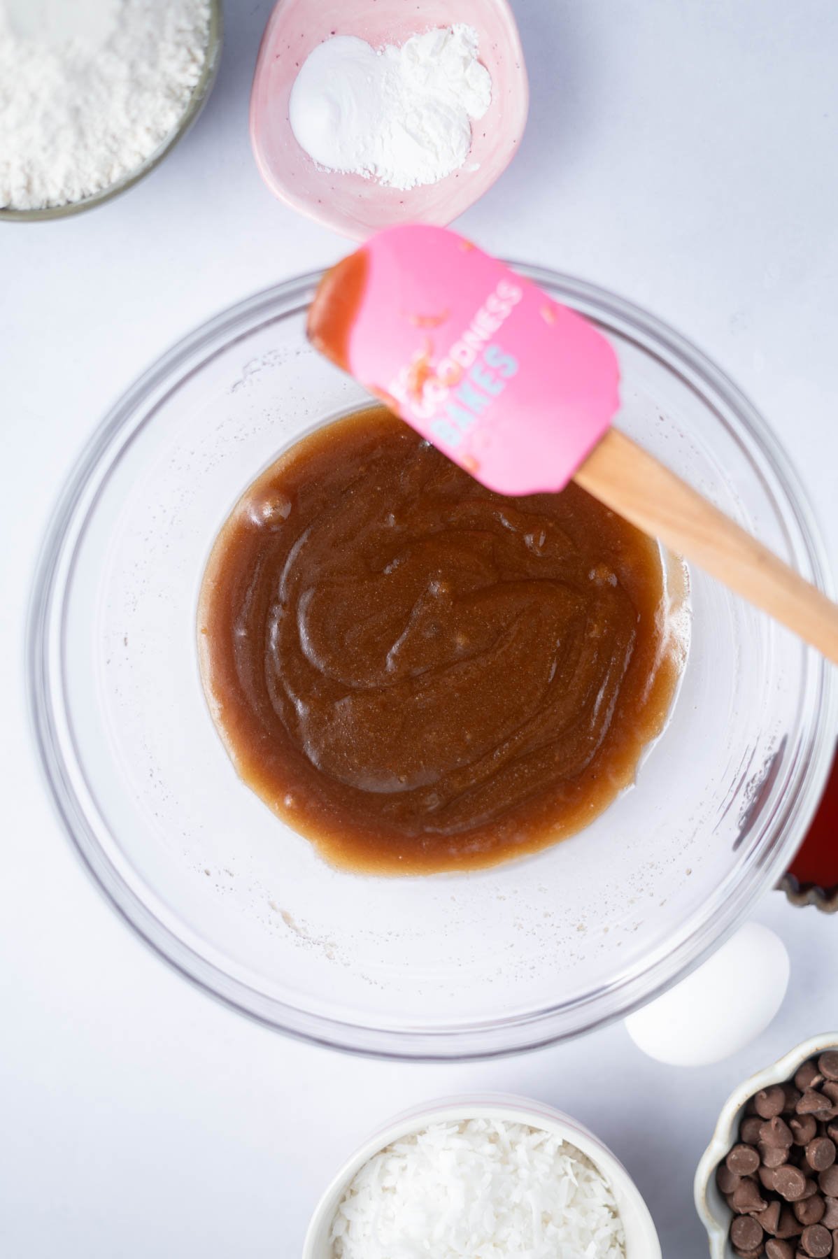 melted butter and sugars mixed together in a glass bowl