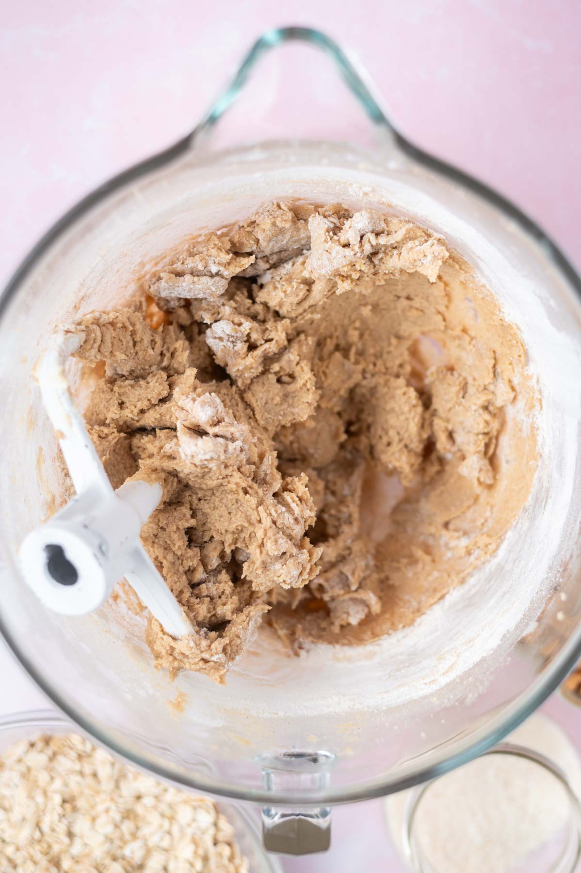 flour added to cookie dough with some large streaks remaining