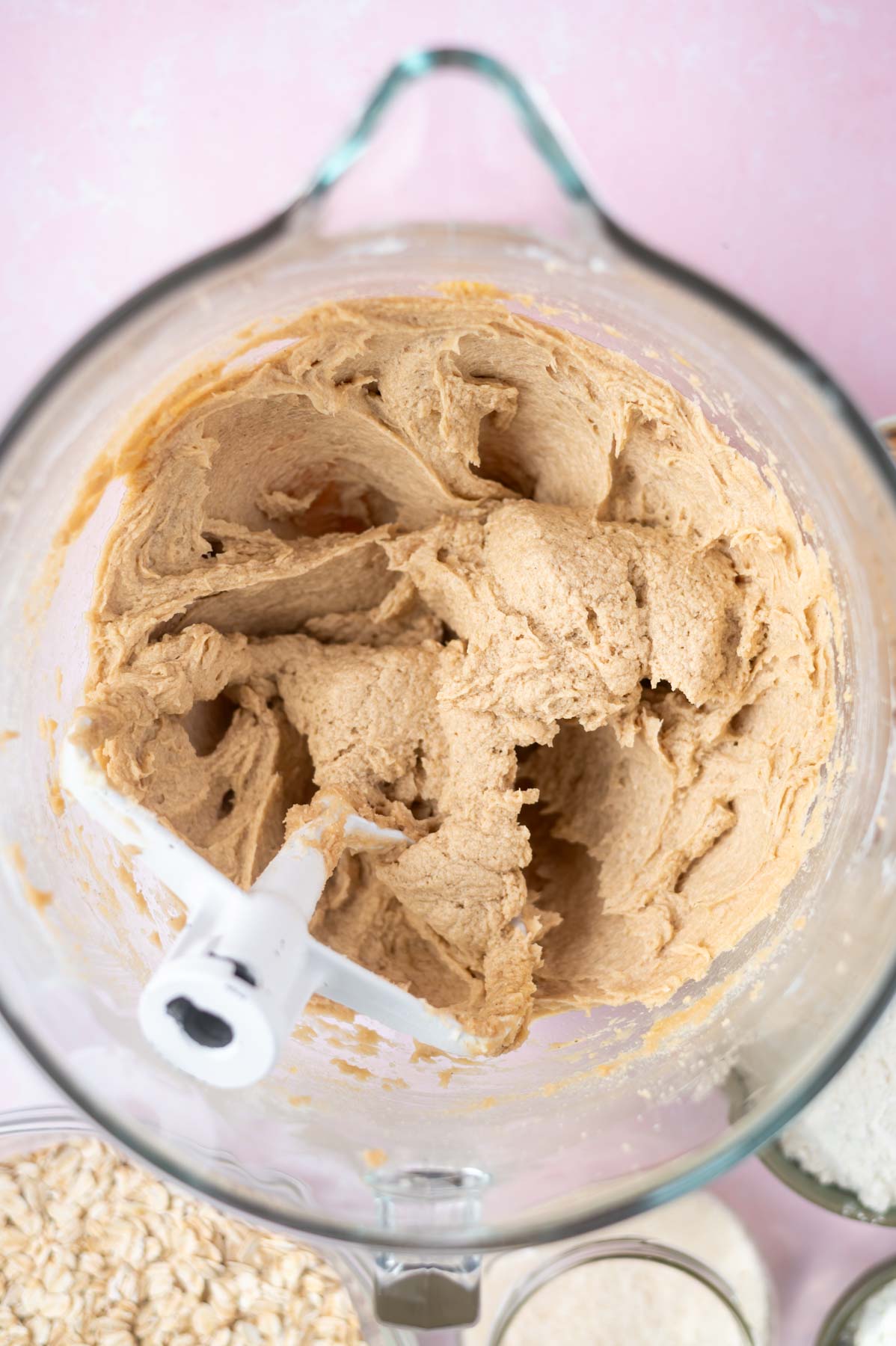 eggs and vanilla added to cookie dough in a mixing bowl