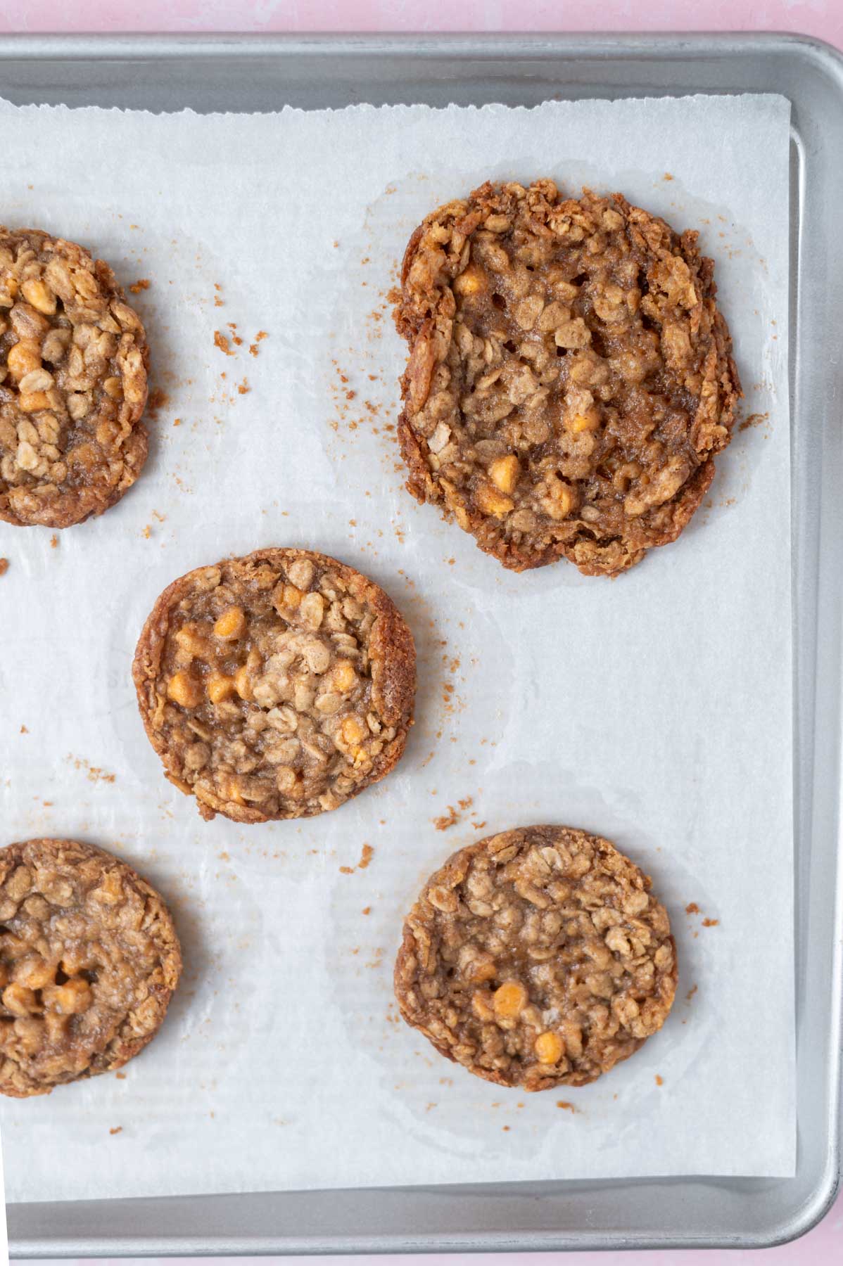 overspread cookie on parchment lined baking pan