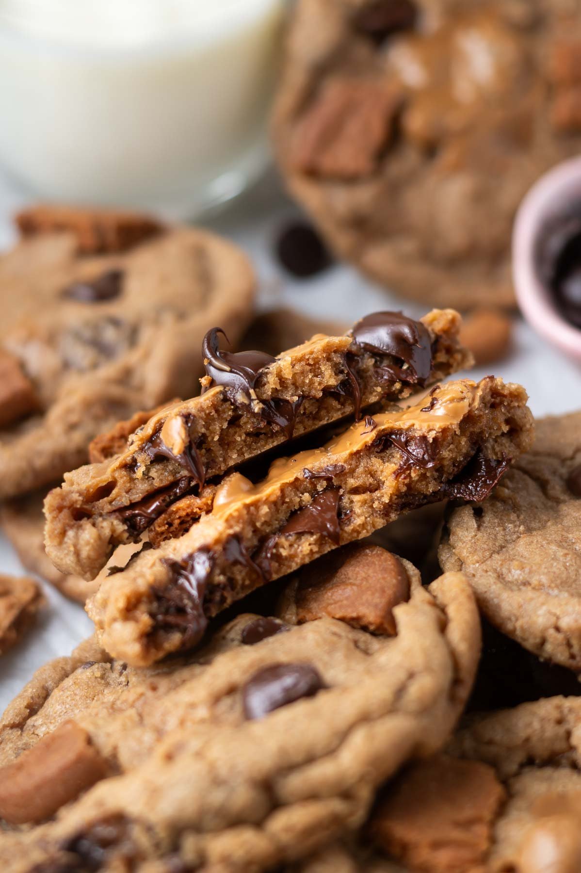 close up look at broken cookie showing the soft middle with melty chocolate chips