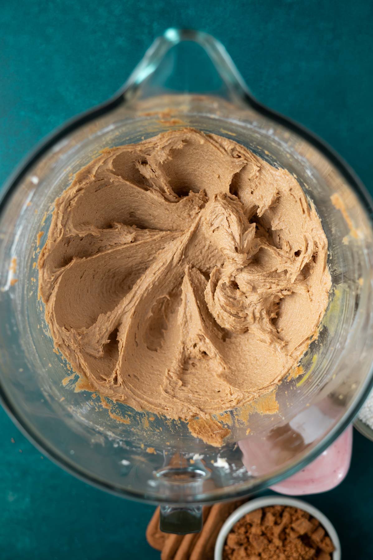 butter, sugars and eggs creamed together in a glass mixing bowl