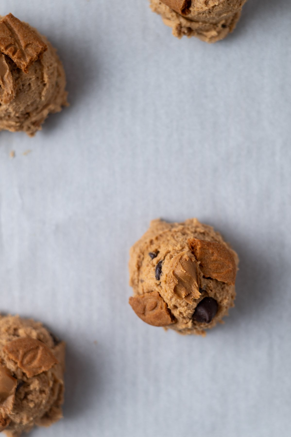 cookie dough on a parchment lined baking sheet