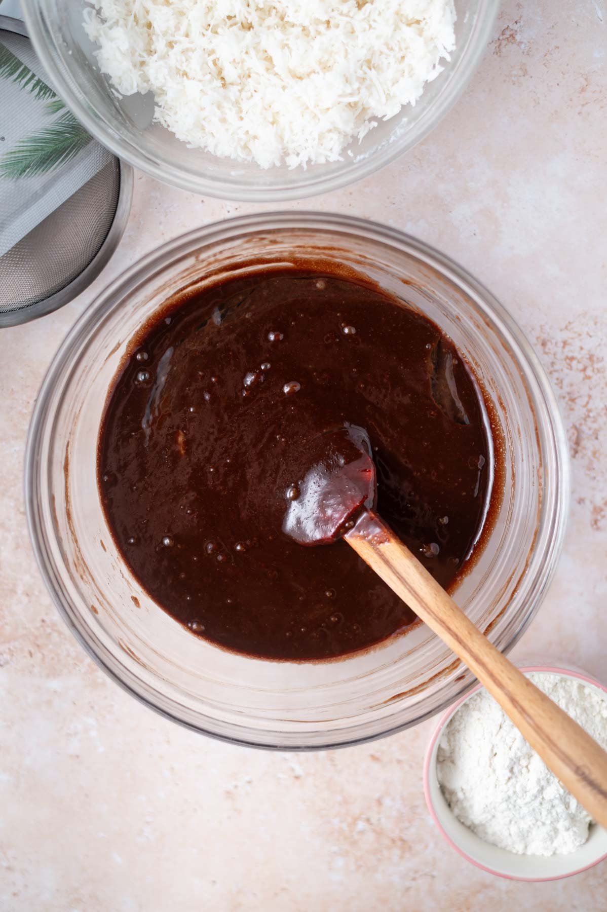 brownie batter in a bowl before flour and coconut milk powder are added