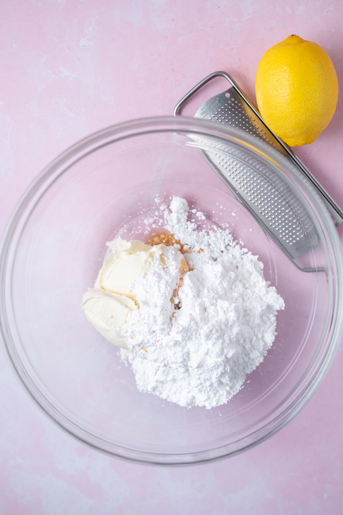 confectioners' sugar, mascarpone and vanilla in a glass bowl