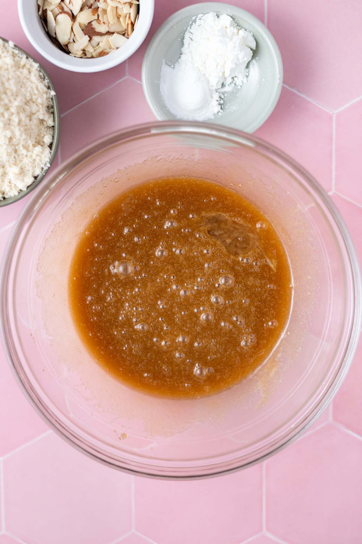 egg and extracts whisked into blondie batter in a glass bowl