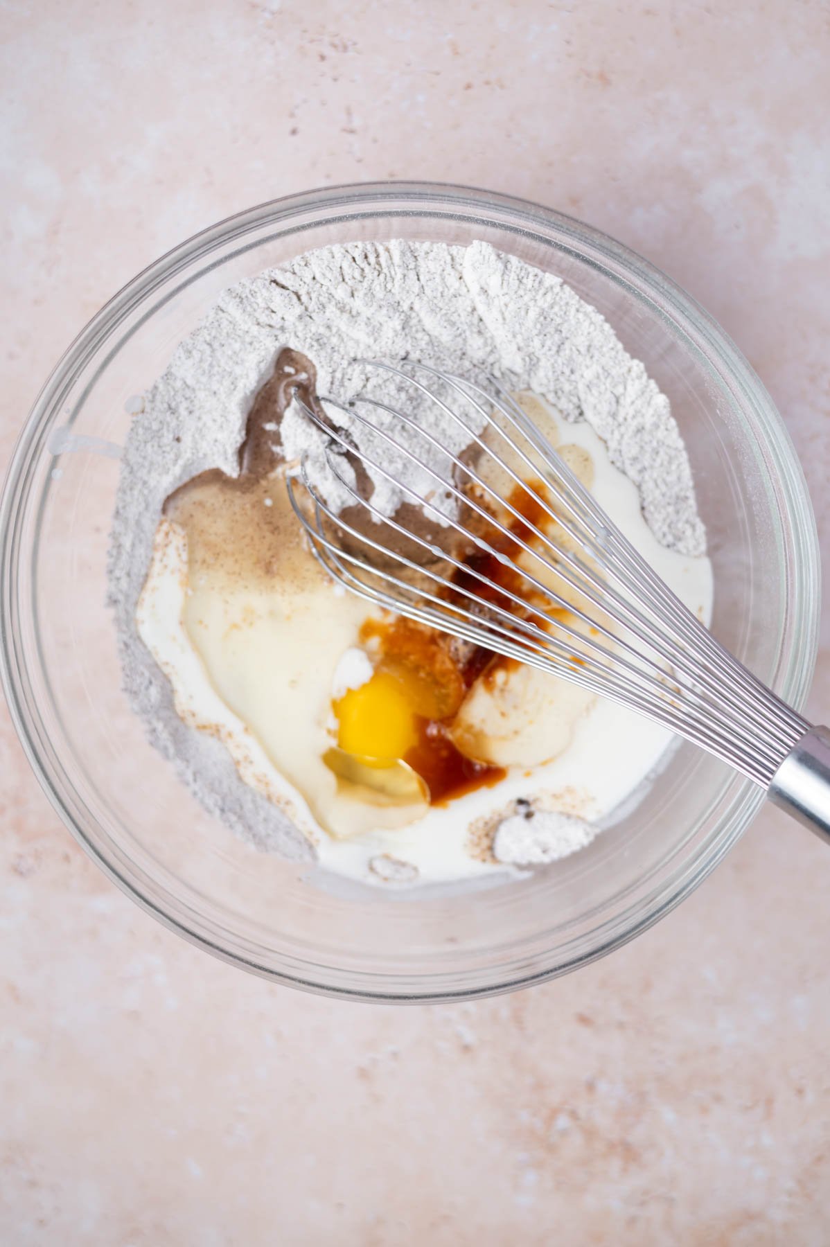 eggs, buttermilk, vanilla and oil added to dry ingredients in a glass bowl