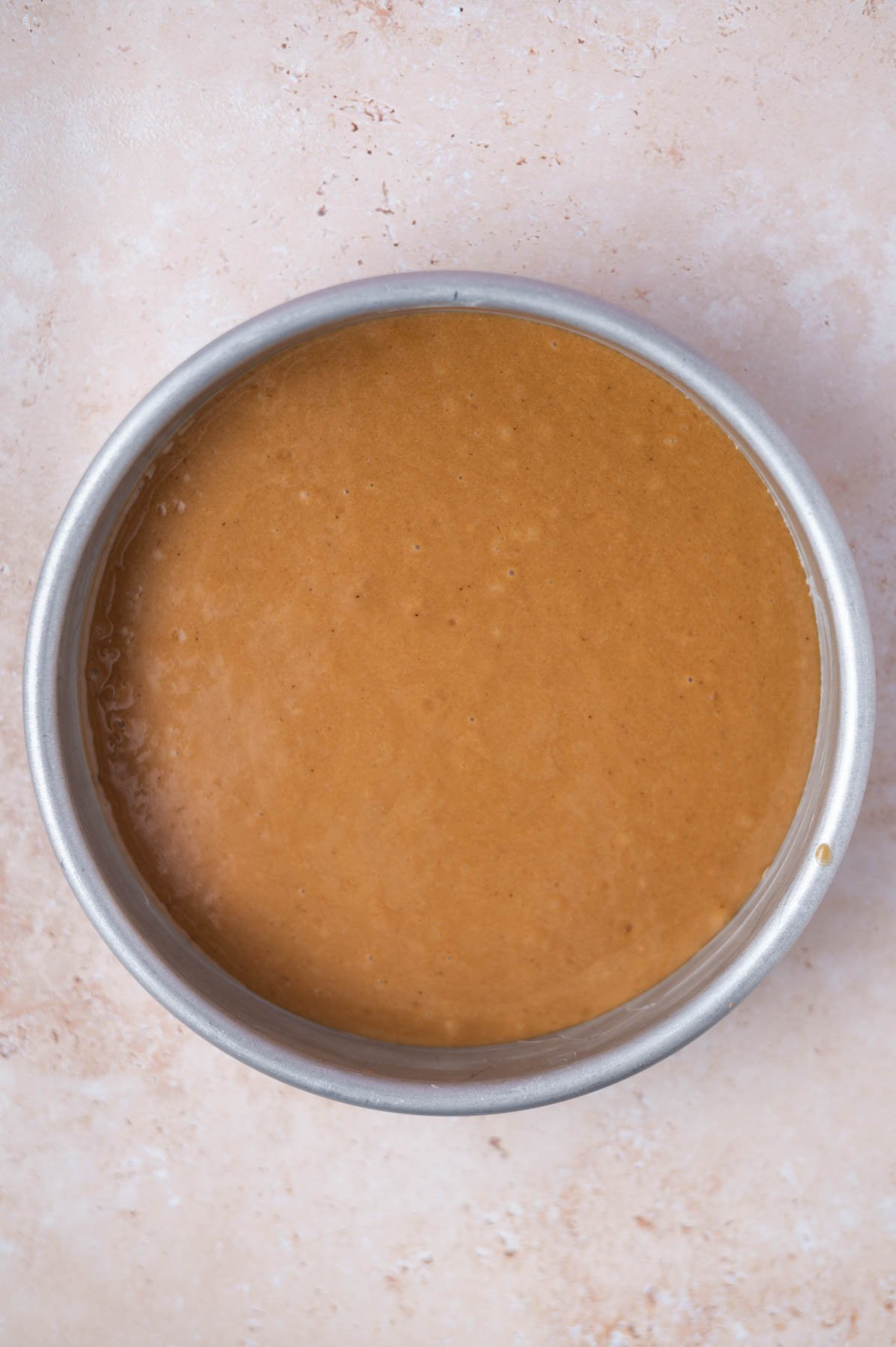 espresso cake batter in a round baking pan