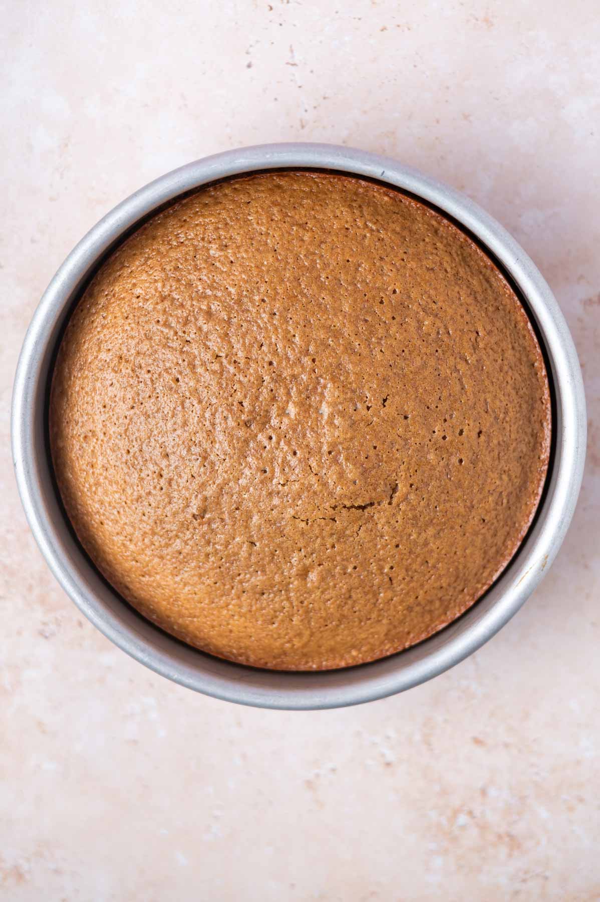 baked cake in a round baking pan