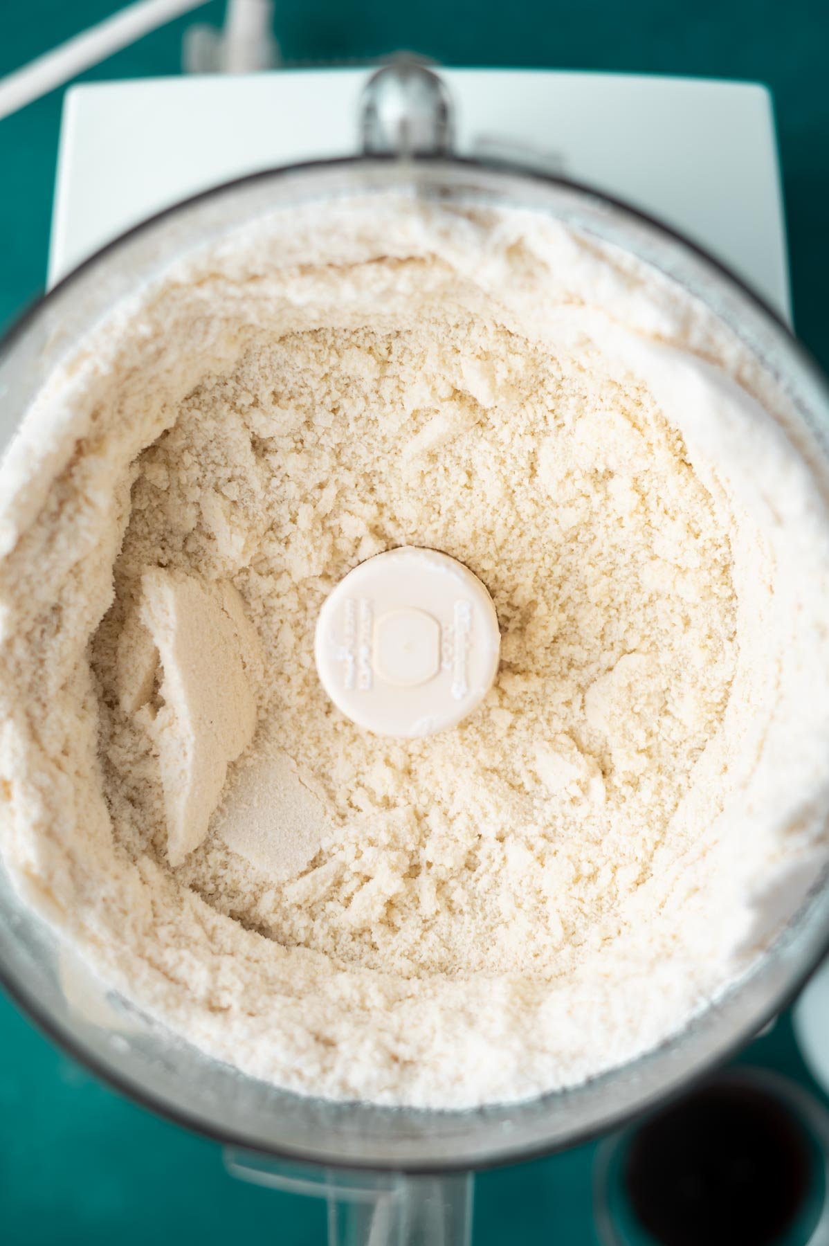 flour, sugars, butter and cream cheese pulsed in a food processor bowl to look like wet sand