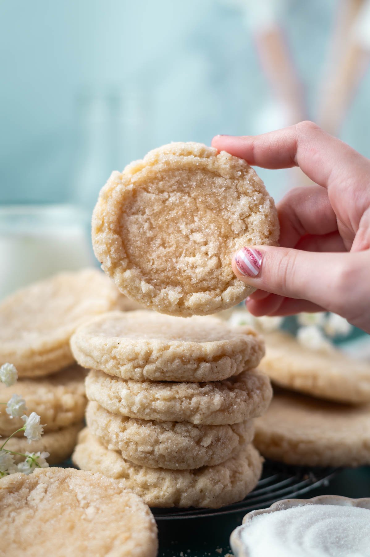 hand grabbing a cookie from a stack