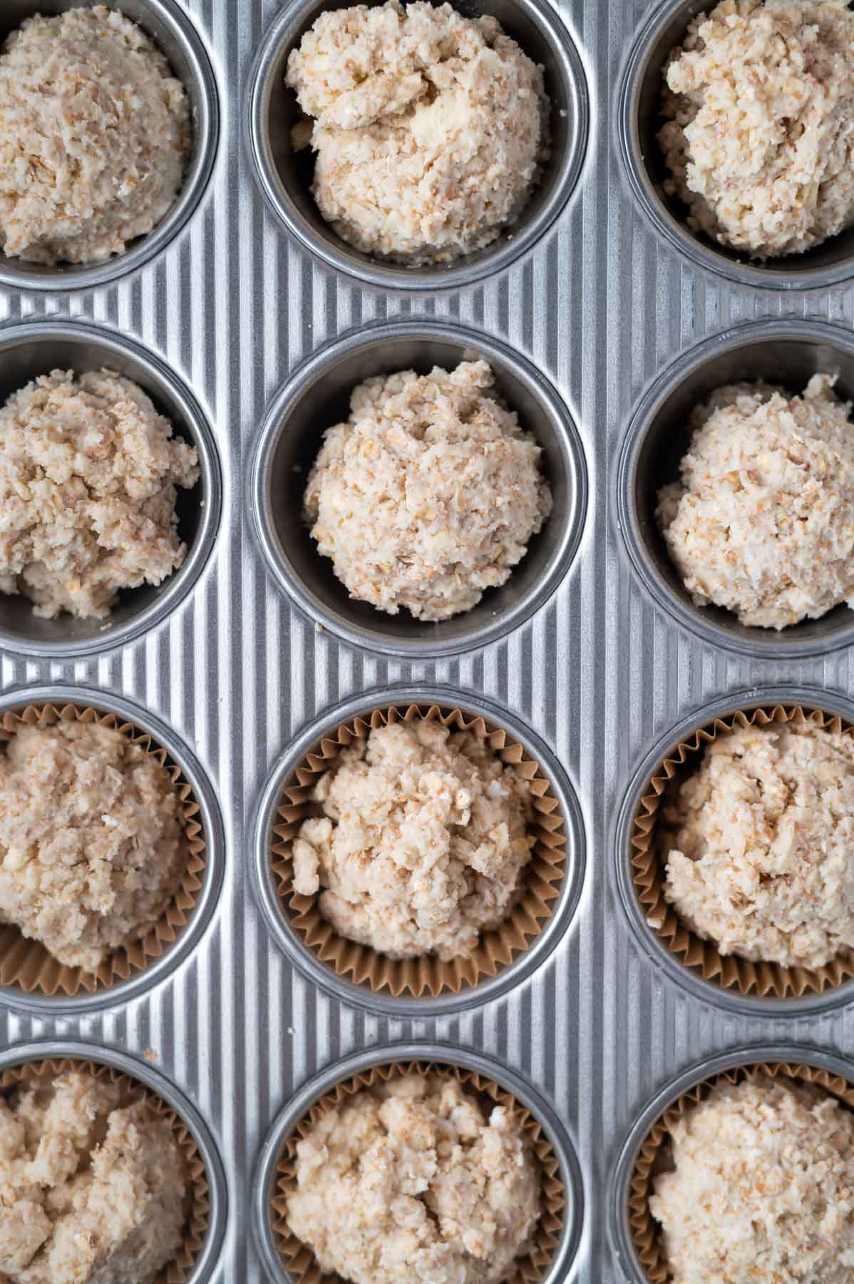 muffin batter in a muffin tin