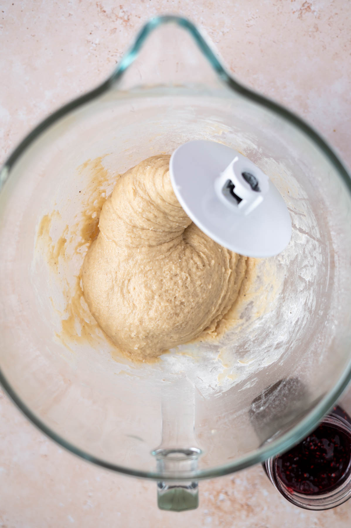 donut dough in a mixing bowl with the dough hook