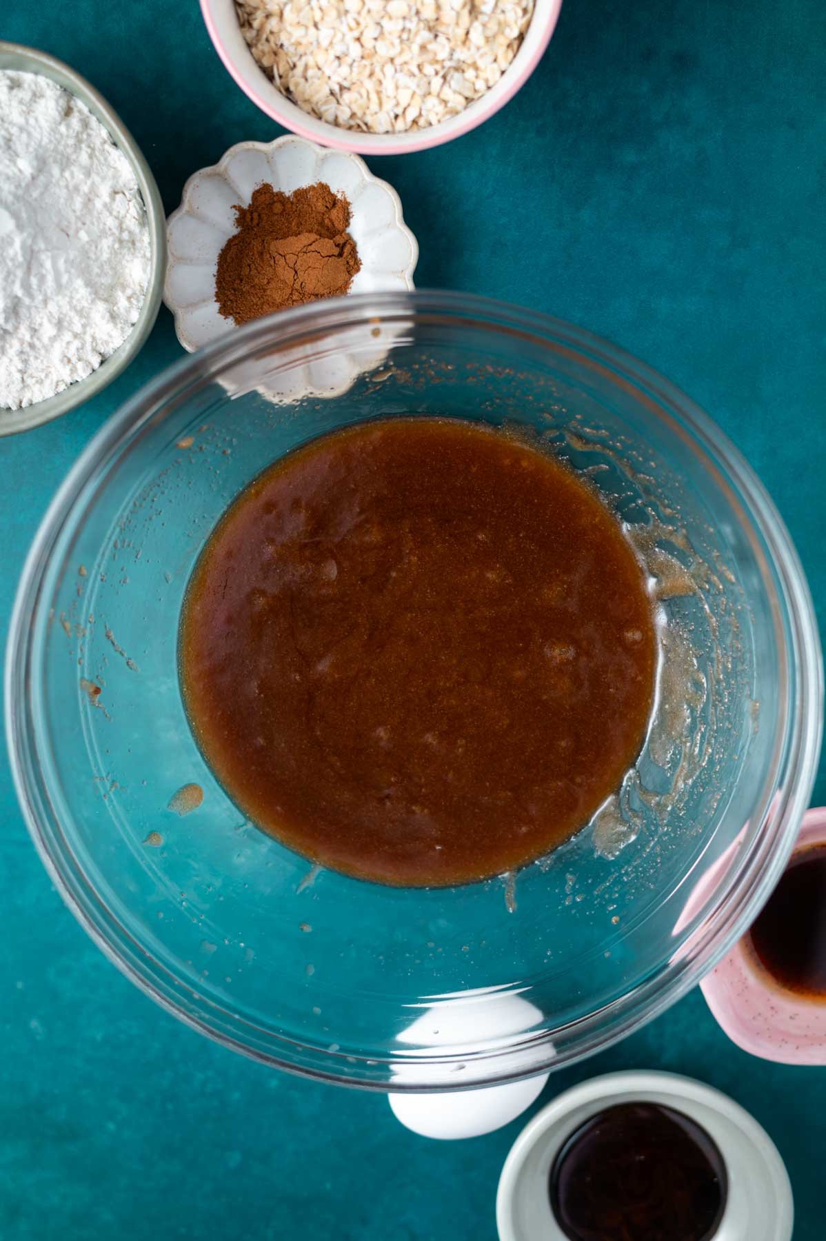 melted butter and brown sugar whisked together in a glass bowl