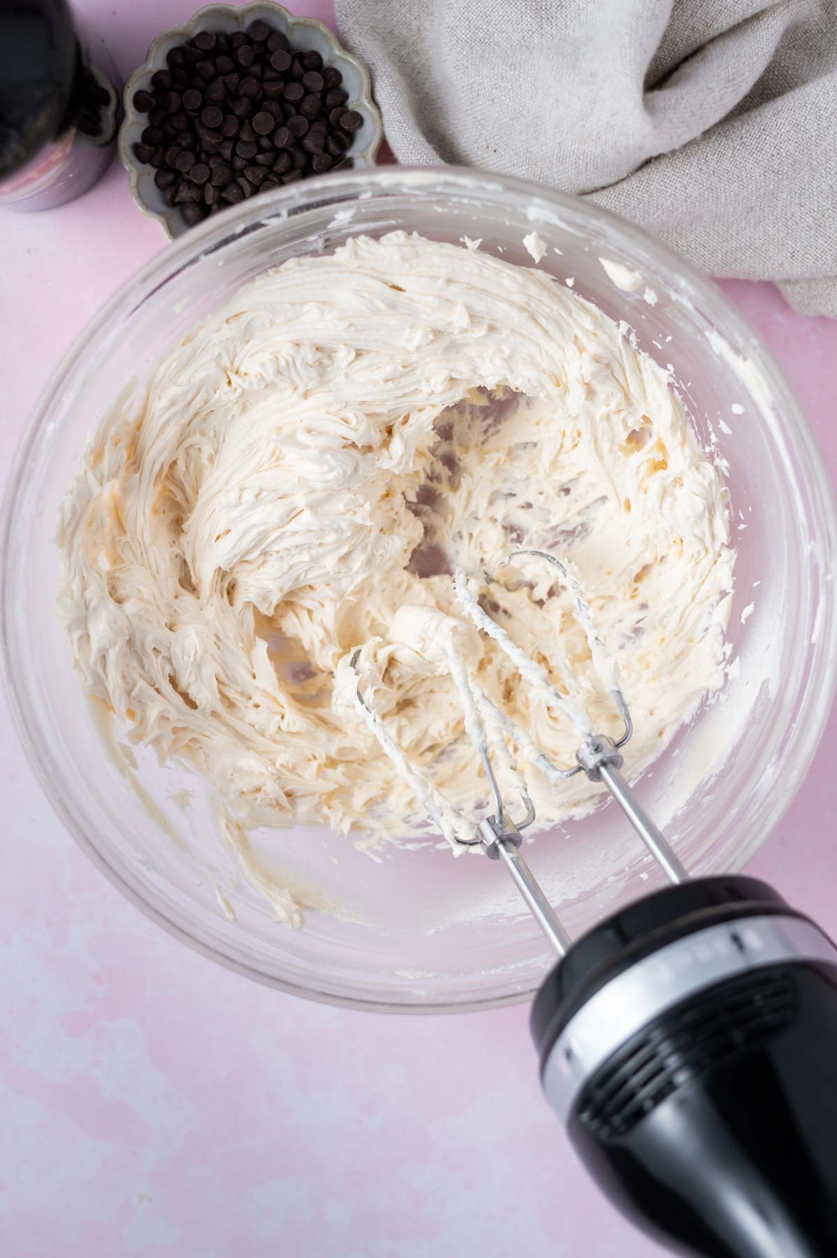 Irish cream frosting in a mixing bowl with a hand mixer