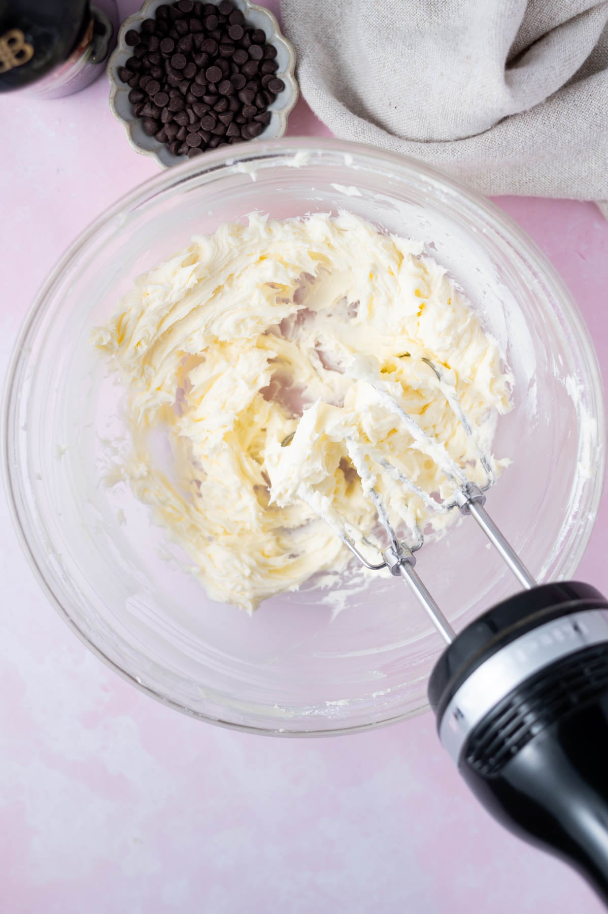 butter and confectioners's sugar creamed together in a glass bowl