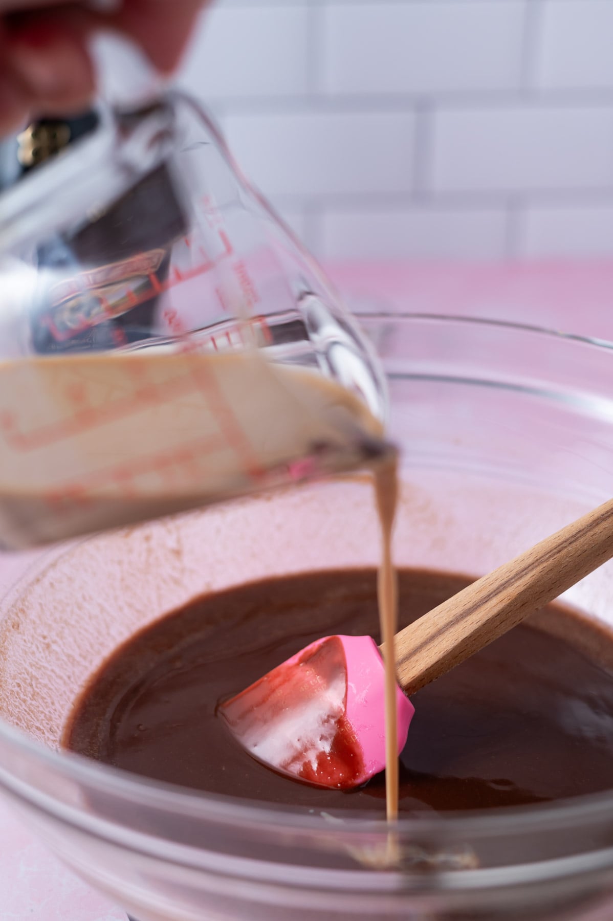 baileys being poured into melted chocolate and butter