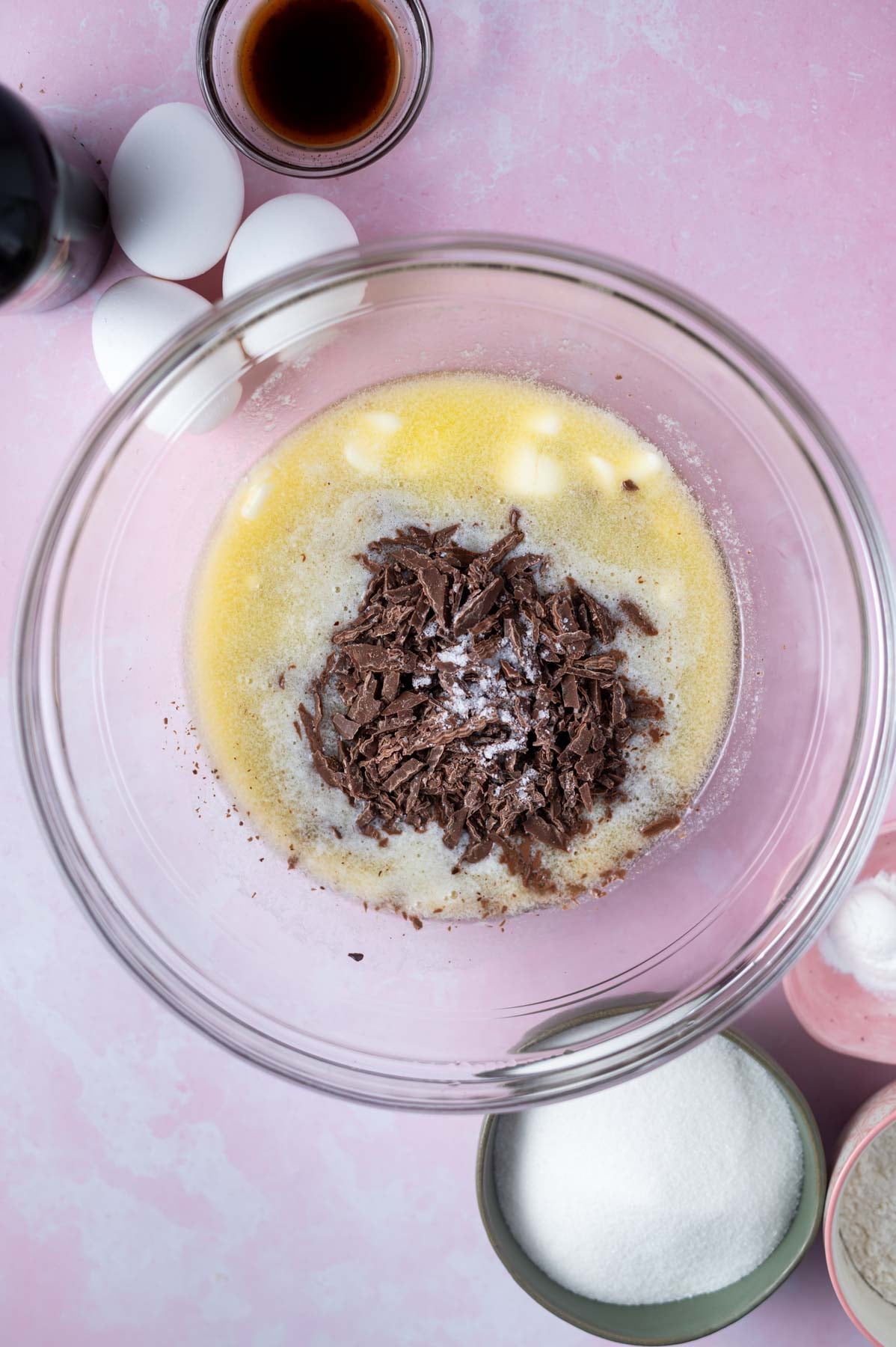 chopped chocolate added to melted butter in a glass bowl