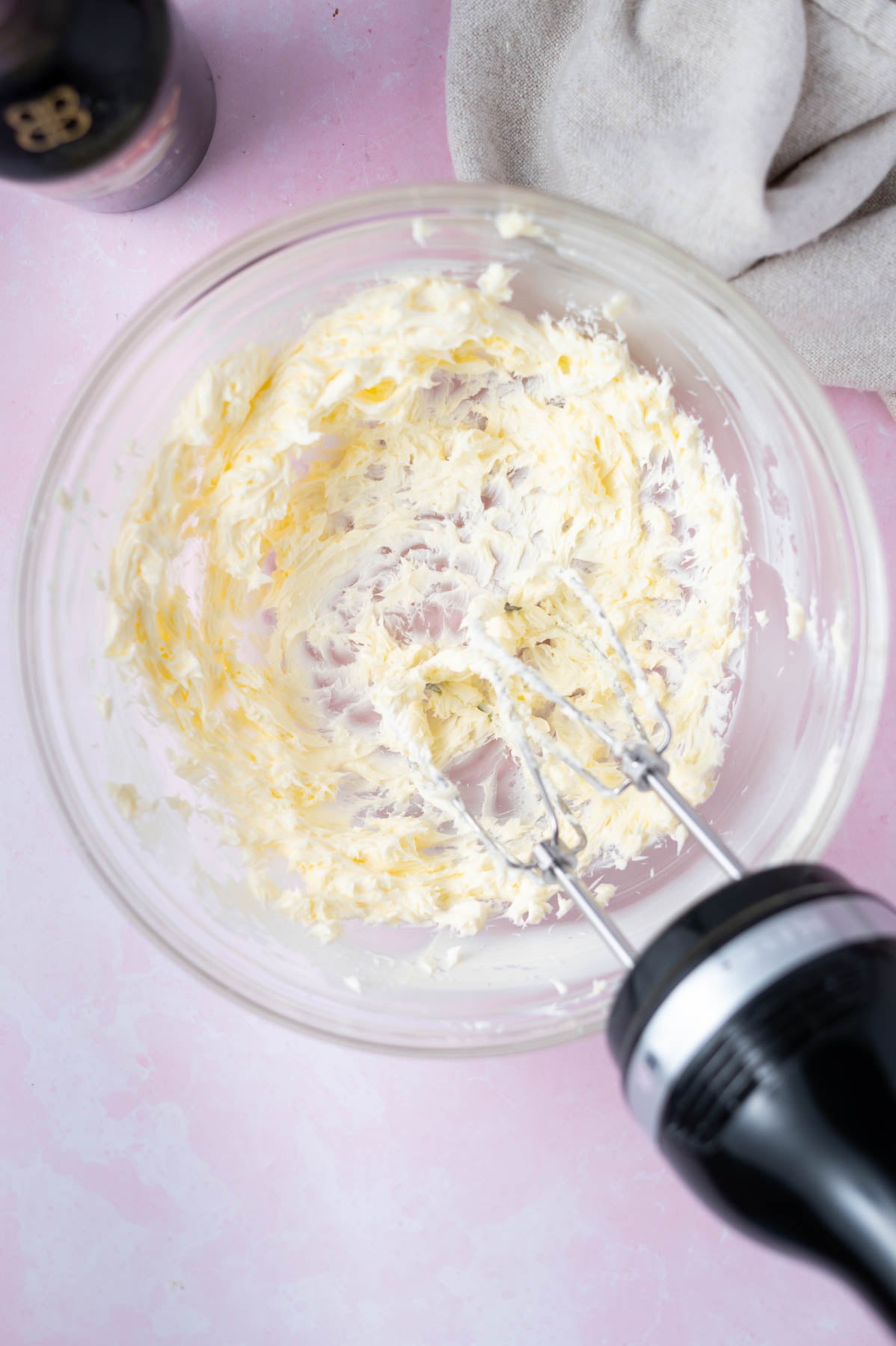 butter creamed with a hand mixer in a bowl