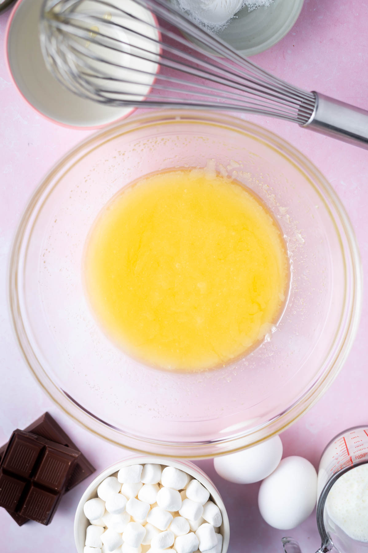 melted butter and sugar whisked together in a glass bowl
