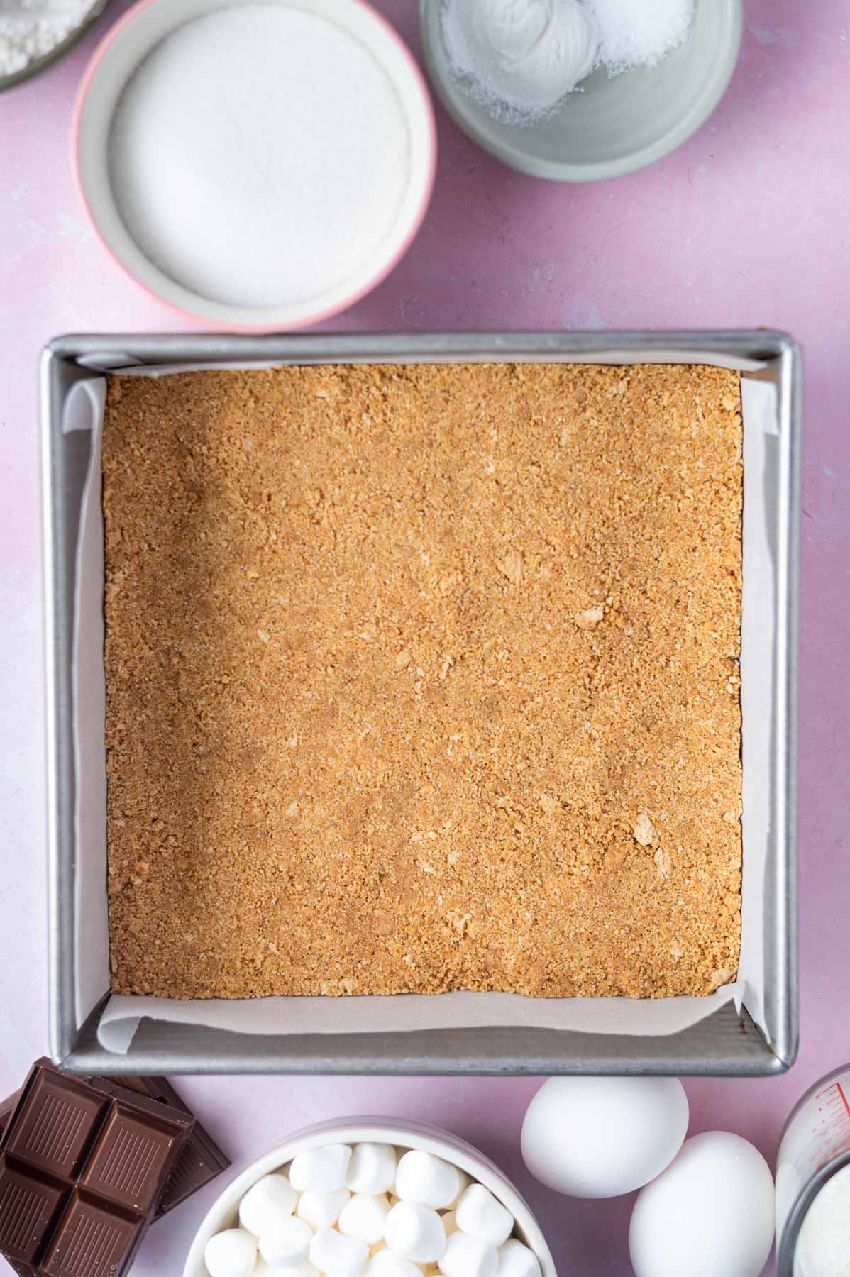 graham cracker crust pressed into a parchment lined 8x8 pan