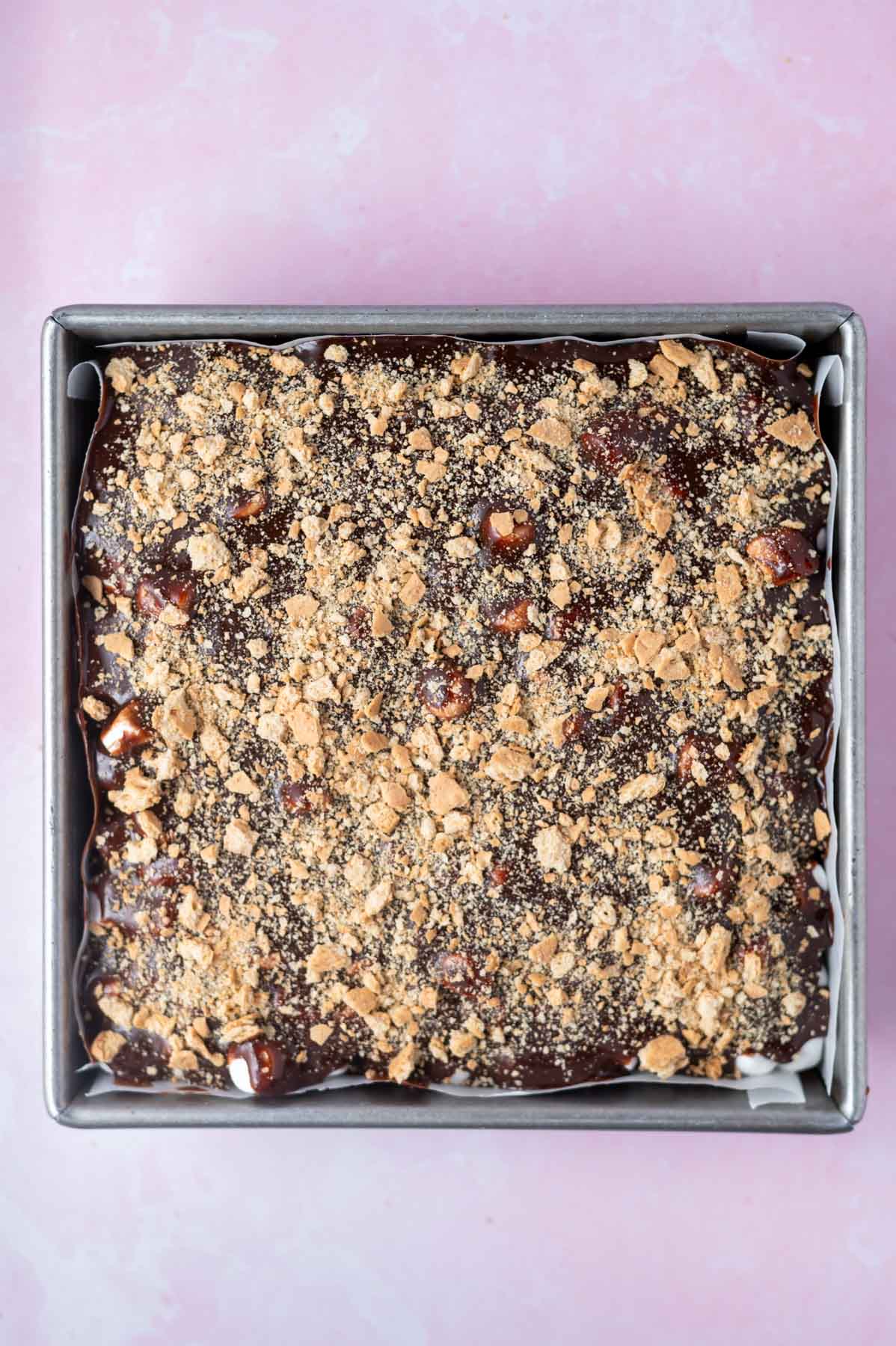 graham cracker crumbs sprinkled over chocolate ganache frosting