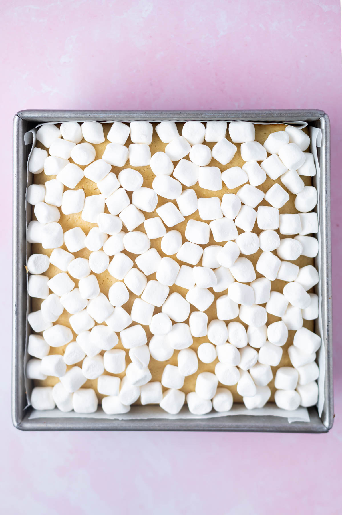 mini marshmallows added over the top of the baked vanilla crumb